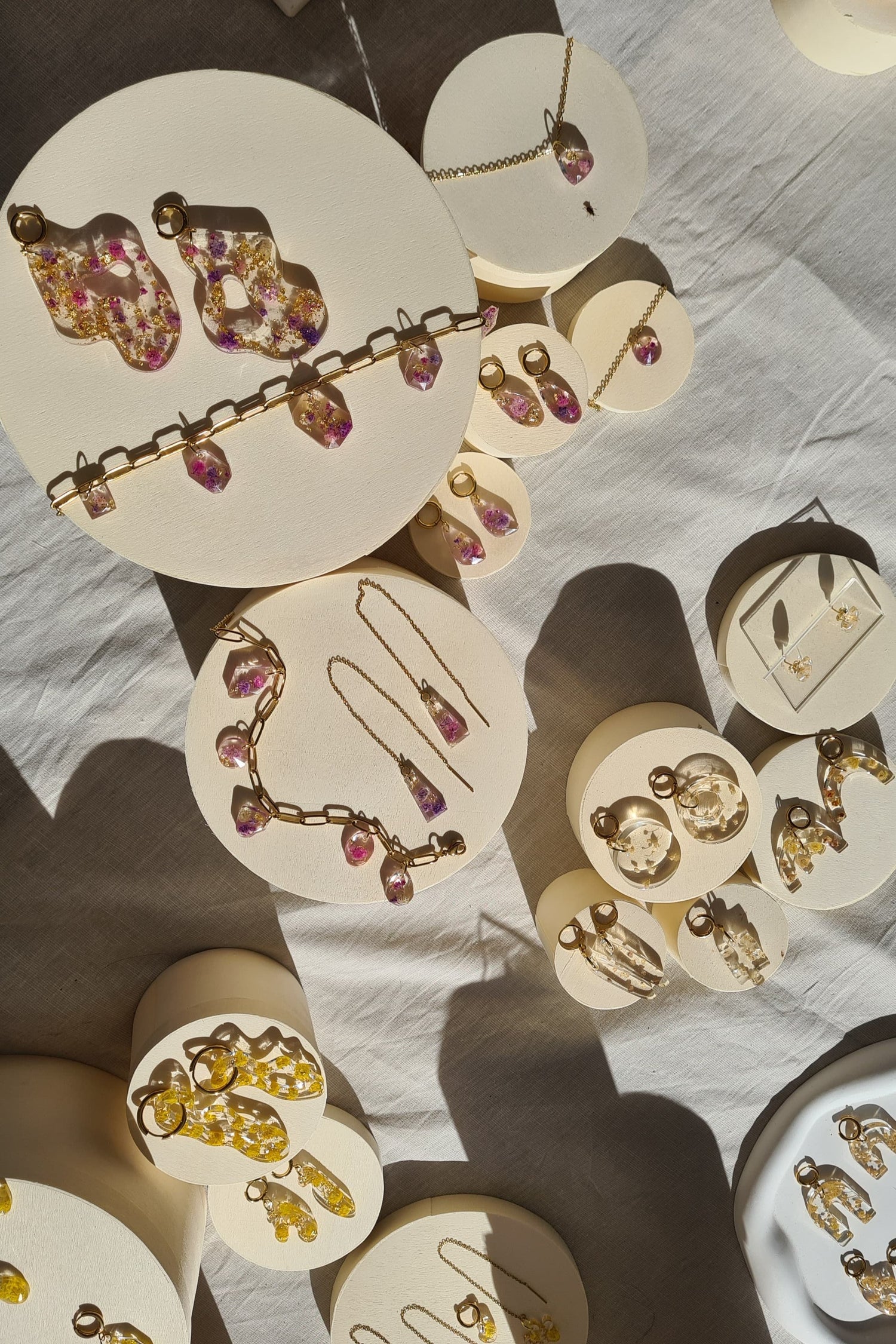 Handmade jewelry in the sun with real flowers made in The Netherlands