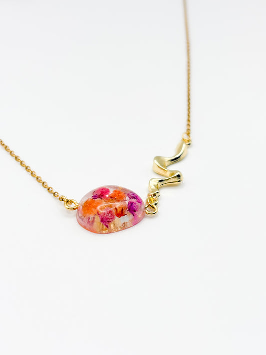 Necklace with a floral pendant on a white background