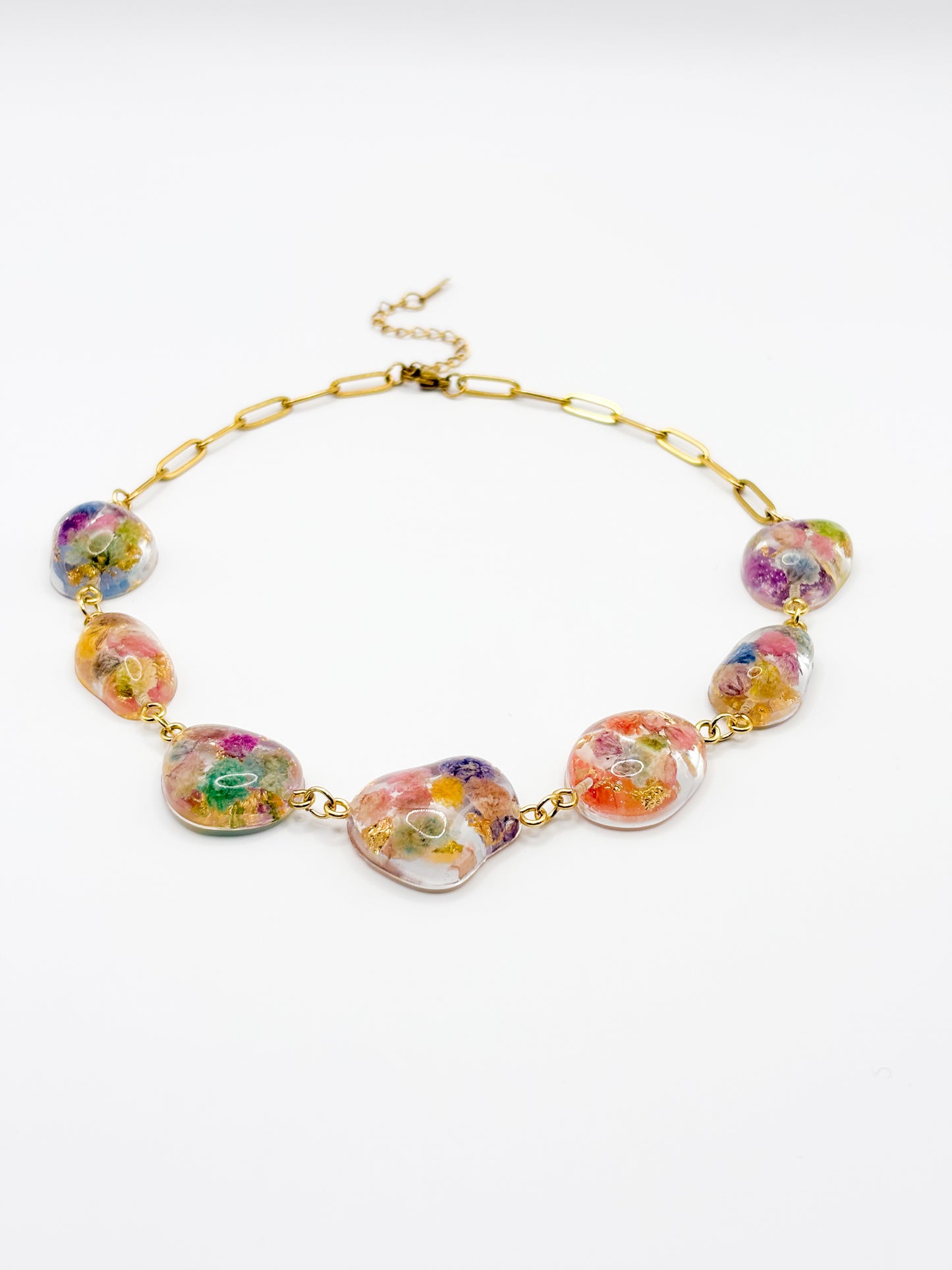 Colorful necklace with floral beads on a white background