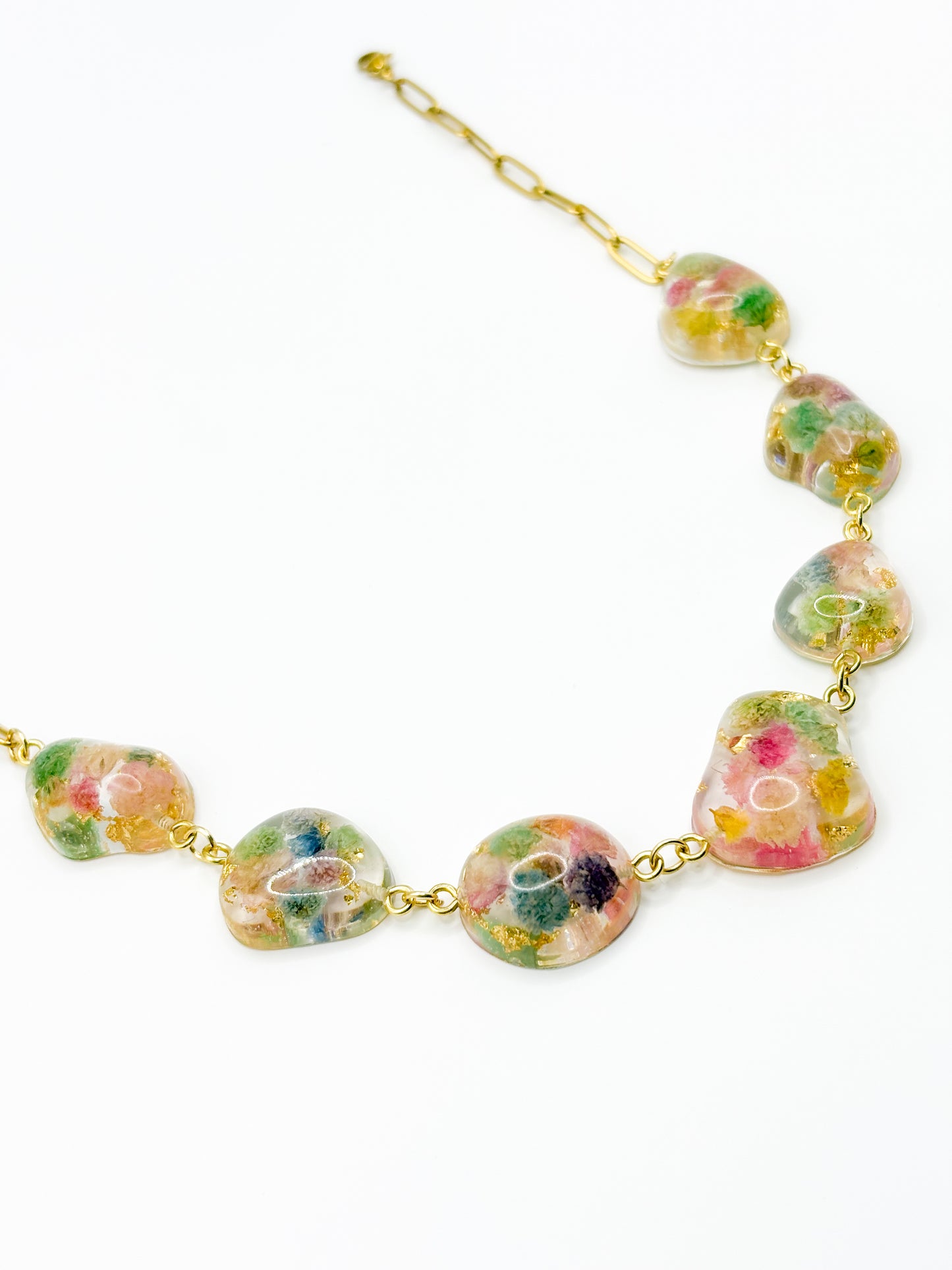 Necklace with floral beads on a white background