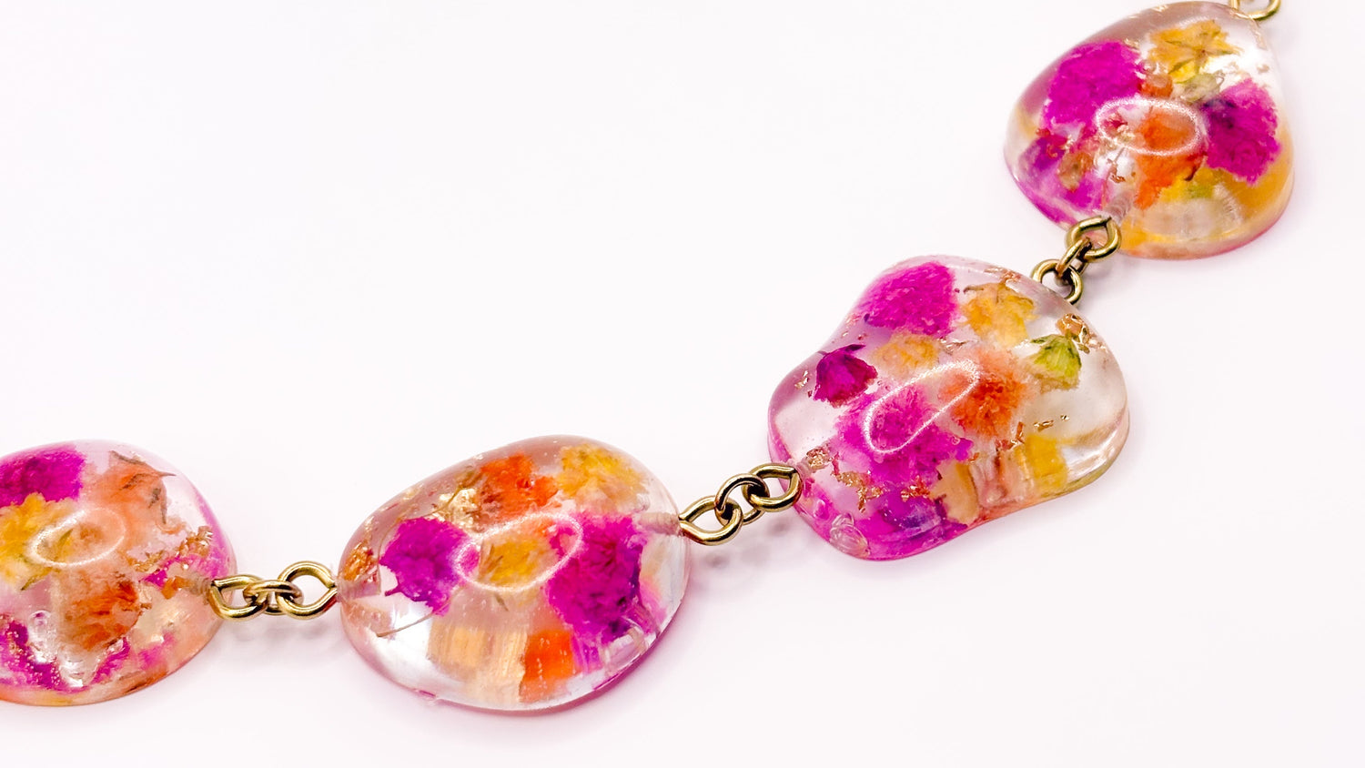 Necklace with floral design on a white background