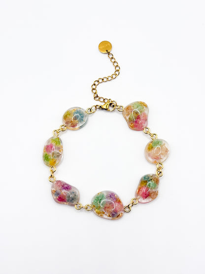 Multicolored floral bracelet on a white background