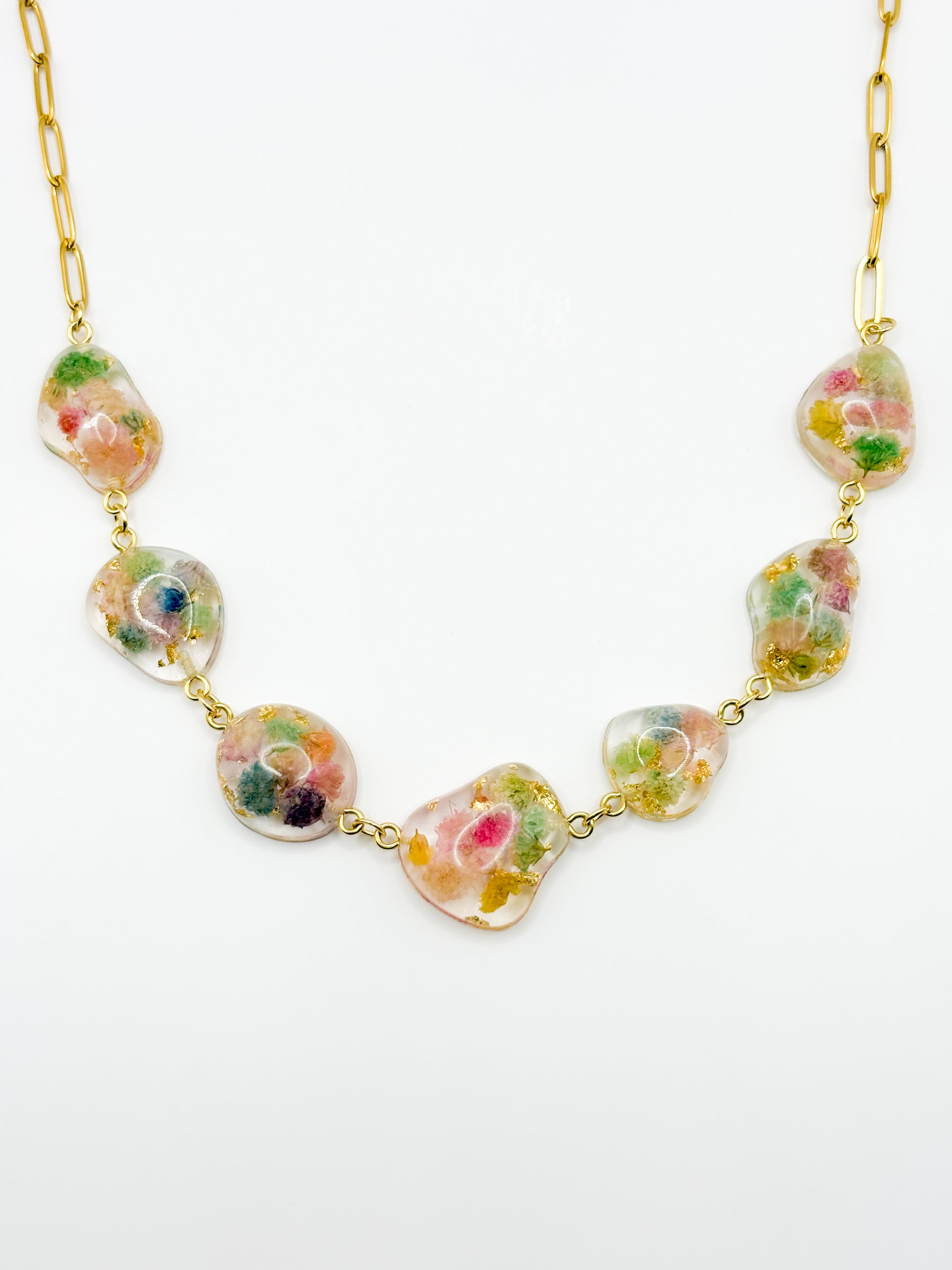 Necklace with floral beads on a white background