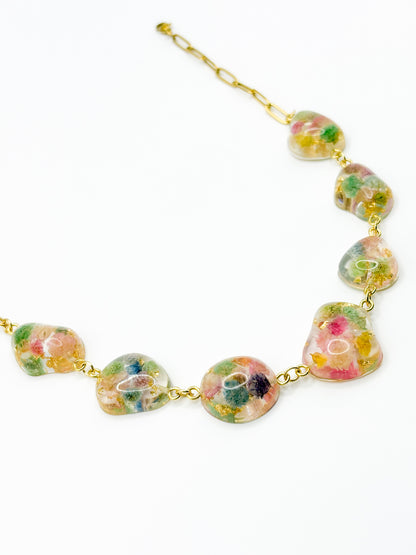 Necklace with floral beads on a white background